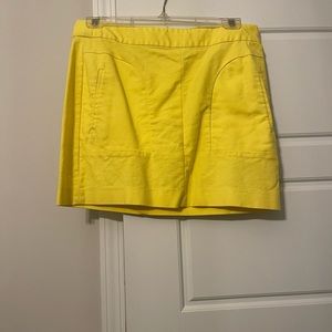 Yellow mini skirt.